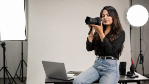 Prabjit Kaur setting up a camera to record content, working alone